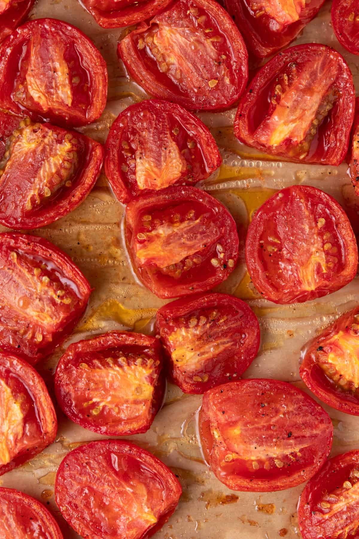 roasted plum tomatoes on a cookie sheet 