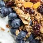 bowl of yogurt with blueberries and granola on top