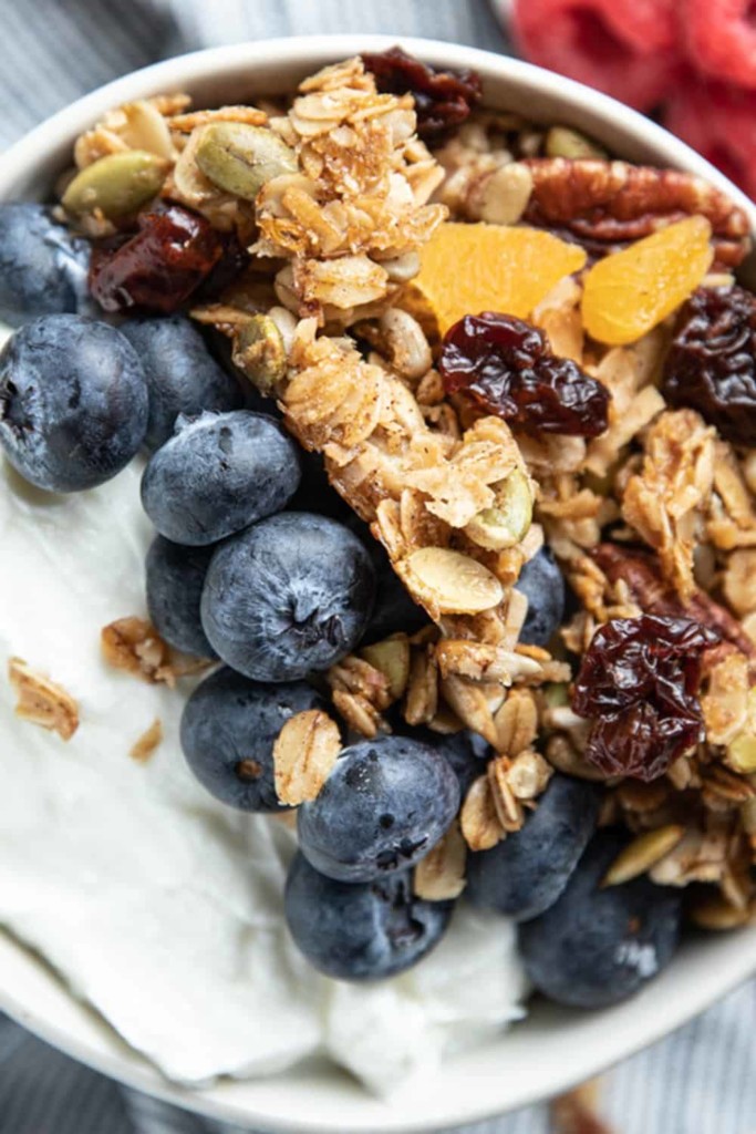 bowl of yogurt with blueberries and granola on top