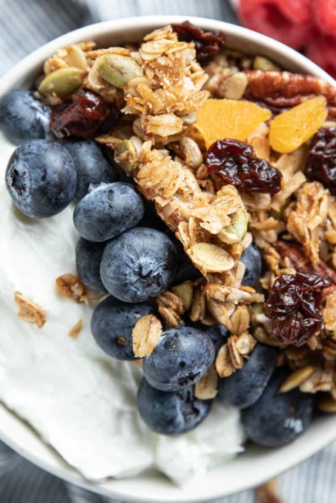 yogurt with blueberries and granola on top