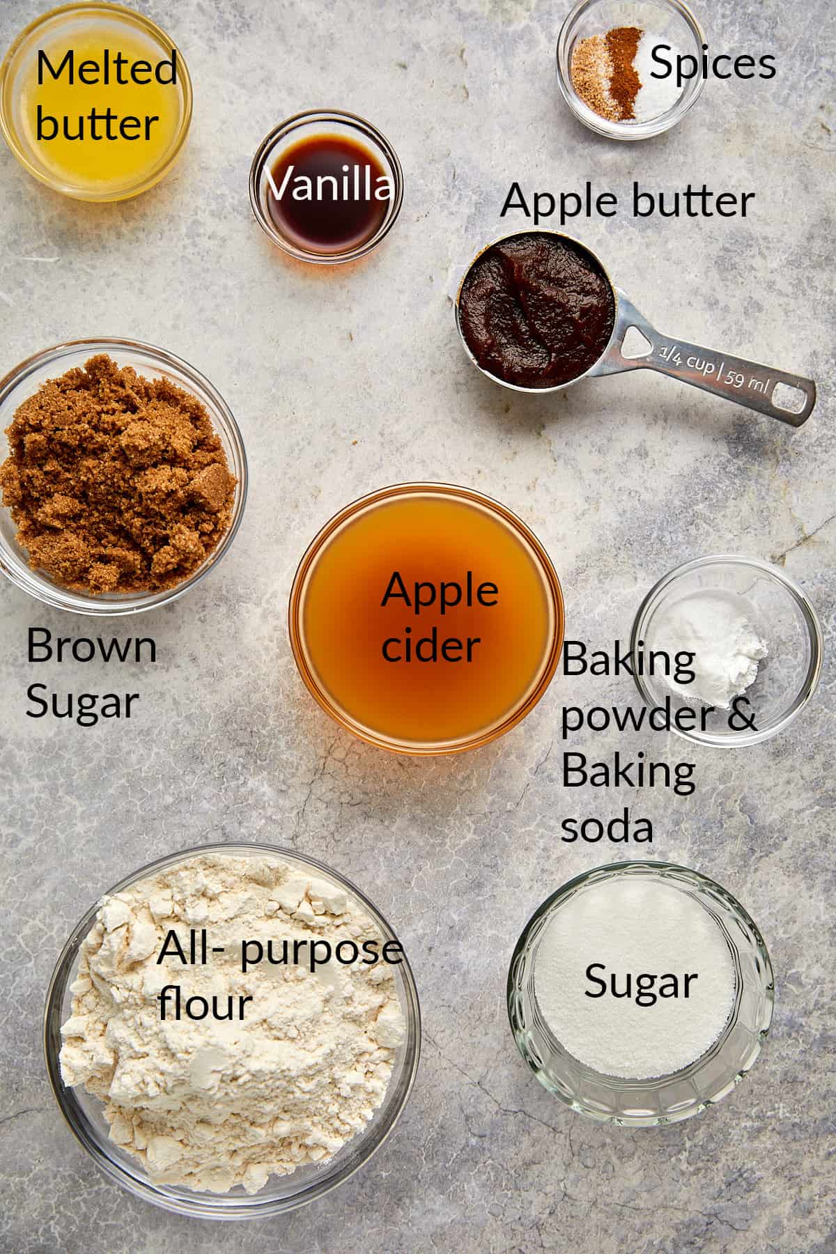 Apple cider donuts ingredients in clear bowls.