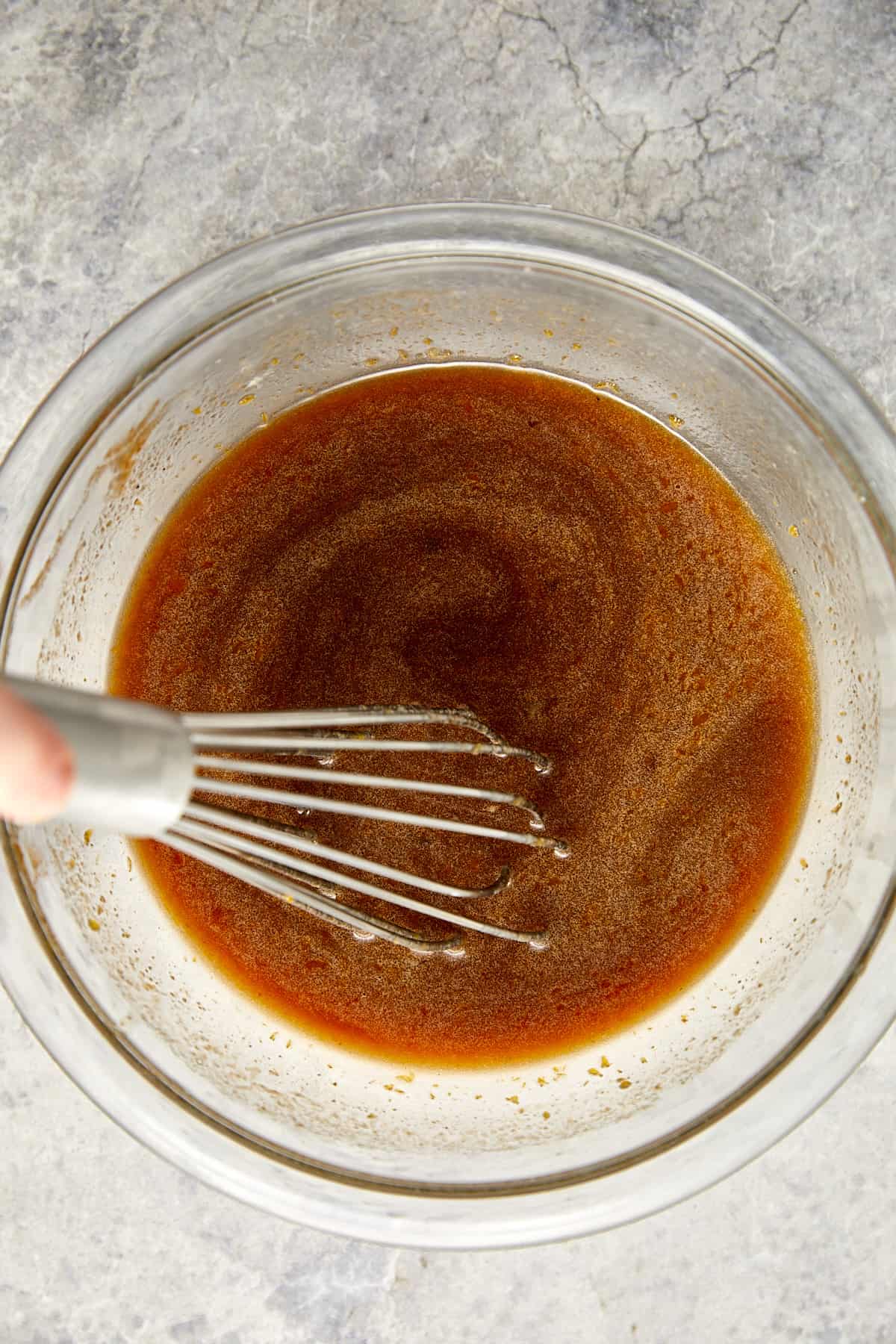 wet ingredients whisked together in a clear bowl. 