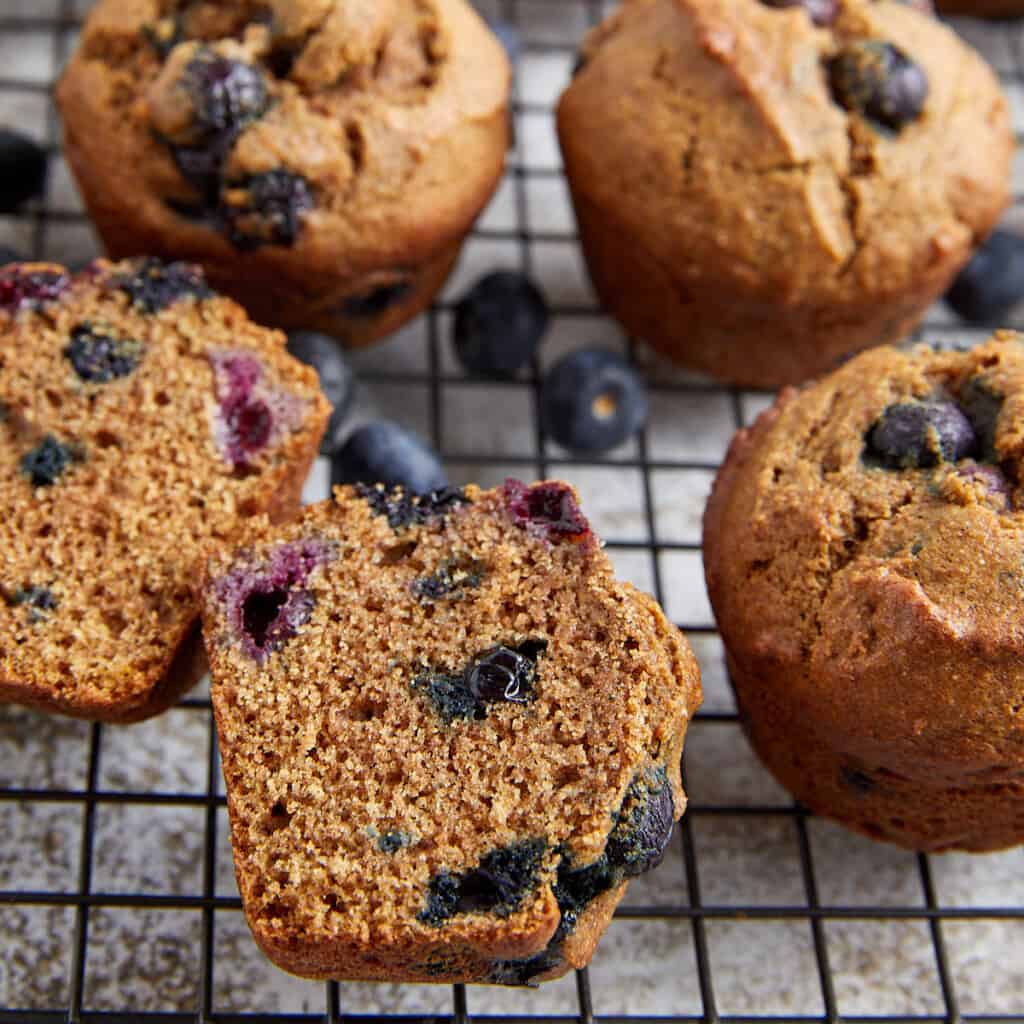 healthy blueberry muffins on wire rack.