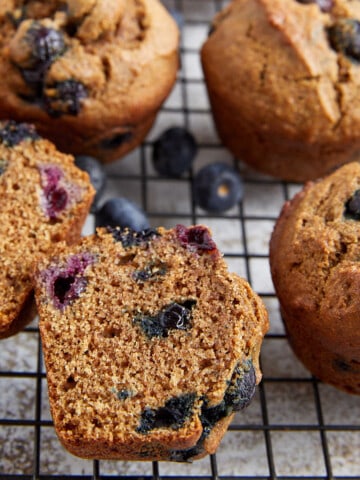 healthy blueberry muffins on wire rack.