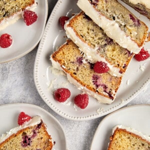 Raspberry and white chocolate loaf cake on white plates