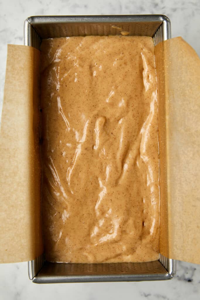 Looking down at the batter in the loaf pan.