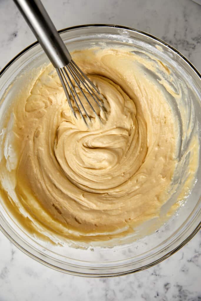 dry and wet ingredients in a glass bowl mixed together.