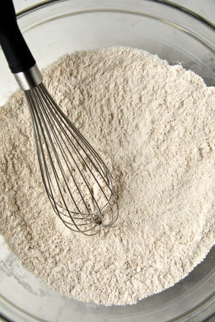 banana bread dry ingredients whisked together in a glass bowl.