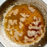 a stainless steel pan with browned butter.