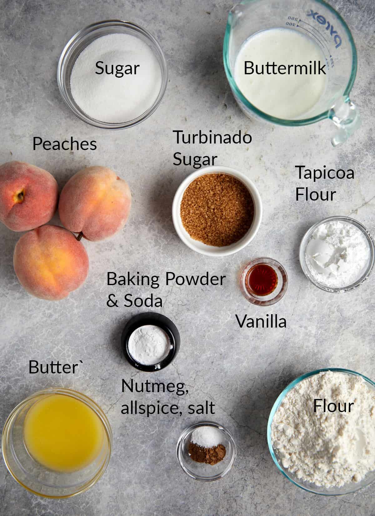 looking down at the ingredients in bowls for cast iron peach cobbler.