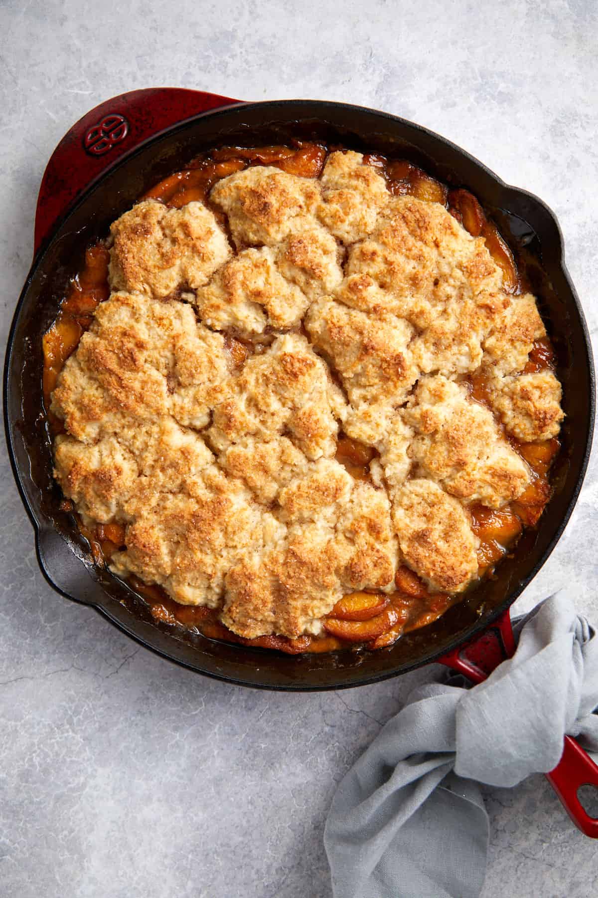 looking down baked cast iron peach cobbler