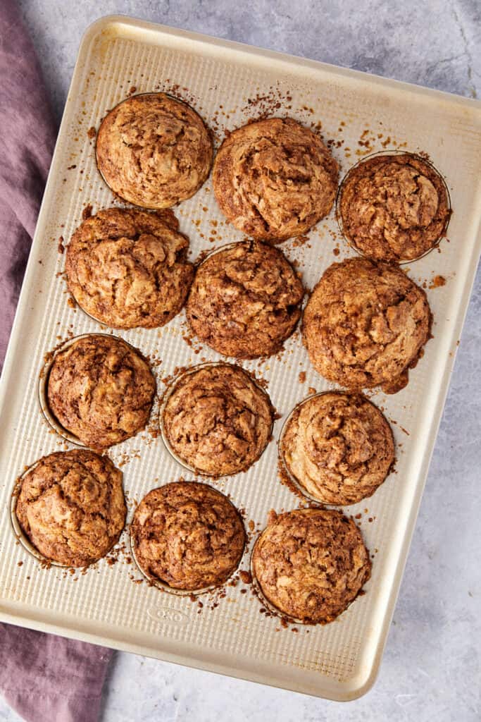 Overhead view of cinnamon swirl banana muffins baked in the muffin tin.