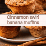 close up view of baked cinnamon swirl banana muffins on a plate.