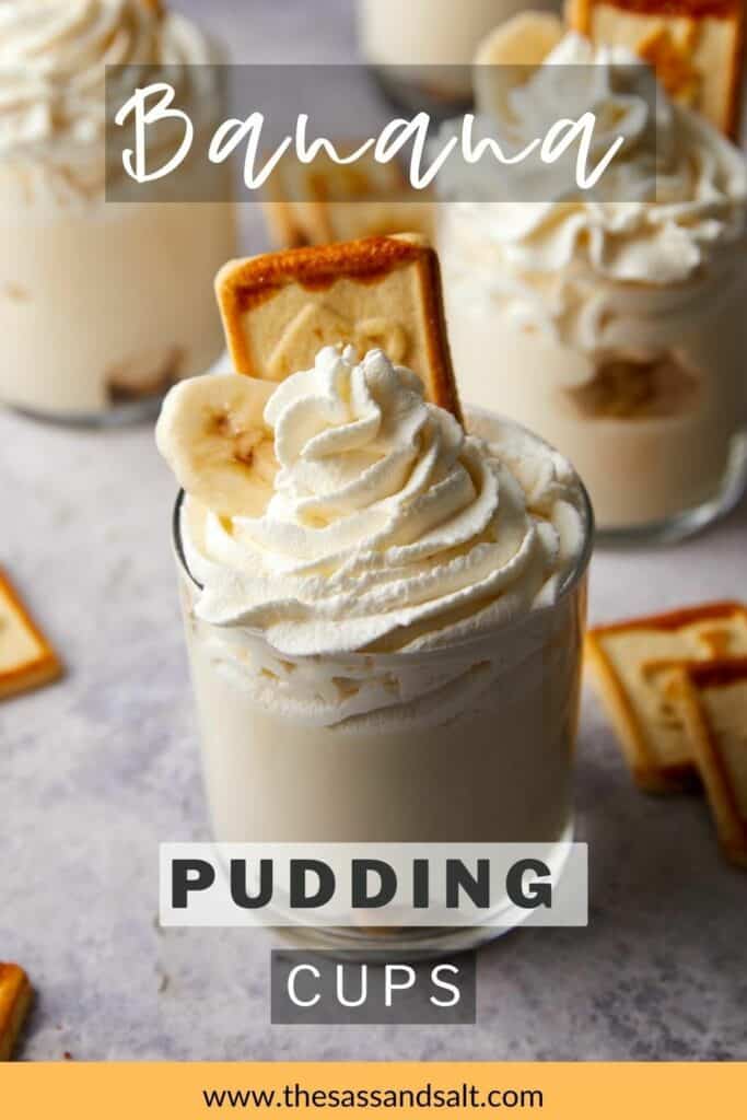 Close up view of homemade banana pudding cups with whipped cream on top.