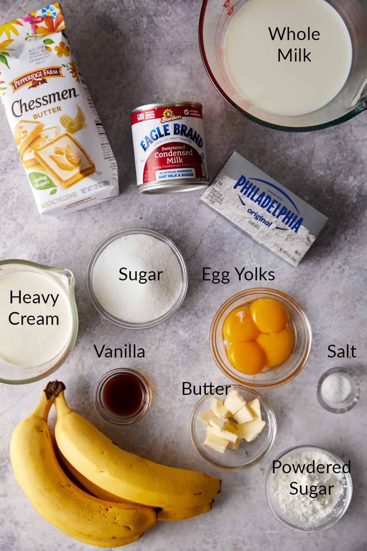Overhead view of banana pudding cup ingredients in bowls.