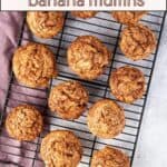 cinnamon swirl banana muffins baked and sitting on a cooling rack.