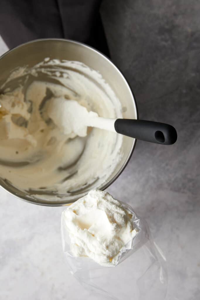 Overhead view of whipped cream in a piping bag.