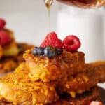 Captain Crunch french toast with maple syrup poured on top.