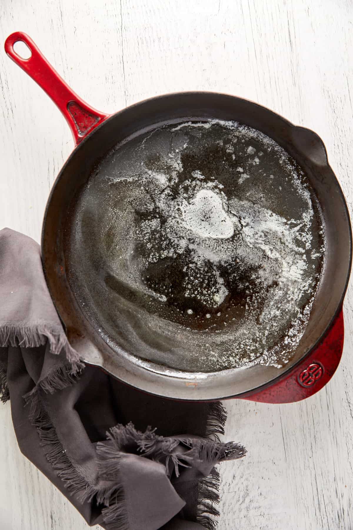 Cast iron pan with melted butter