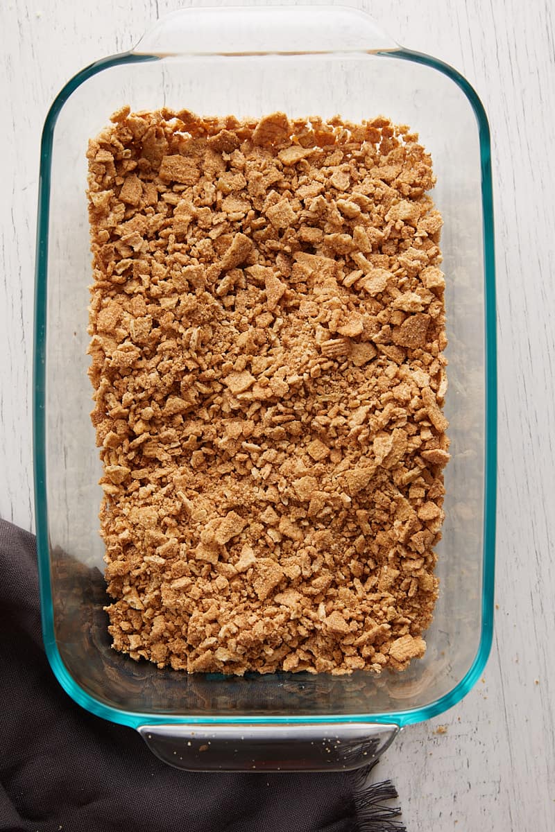 Overhead view of cinnamon toast crunch crumbles in a glass dish.