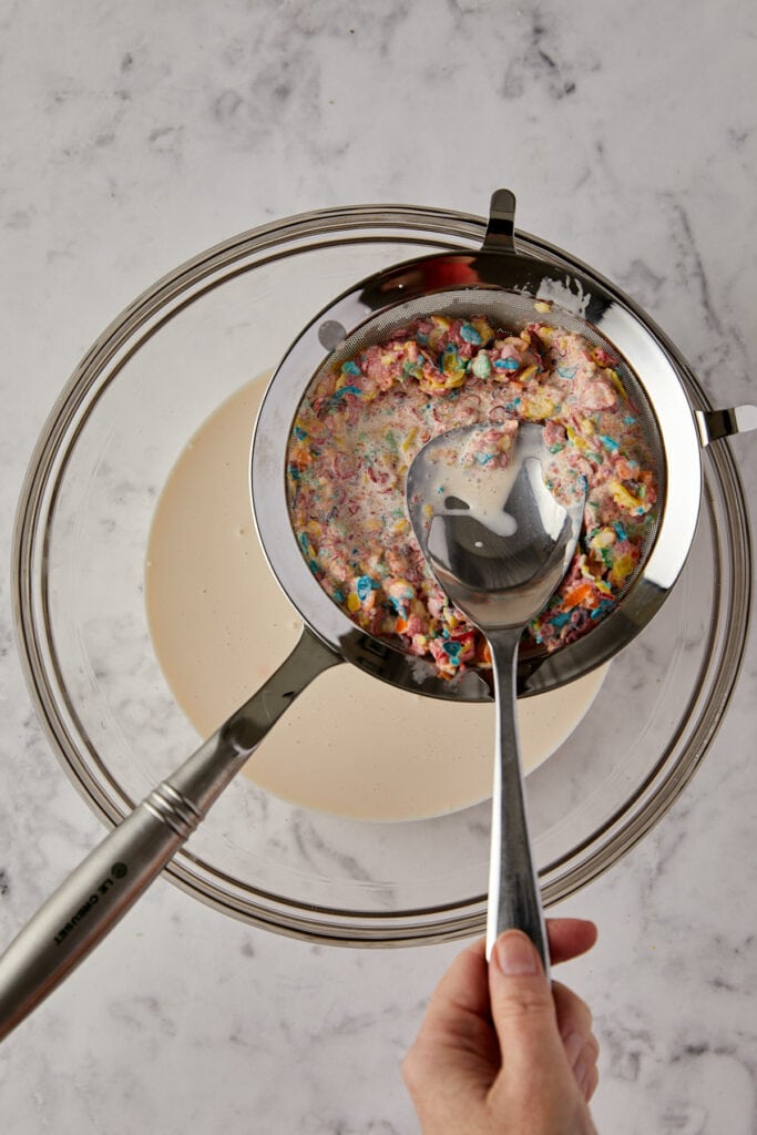 Overhead view of cereal in a sieve.