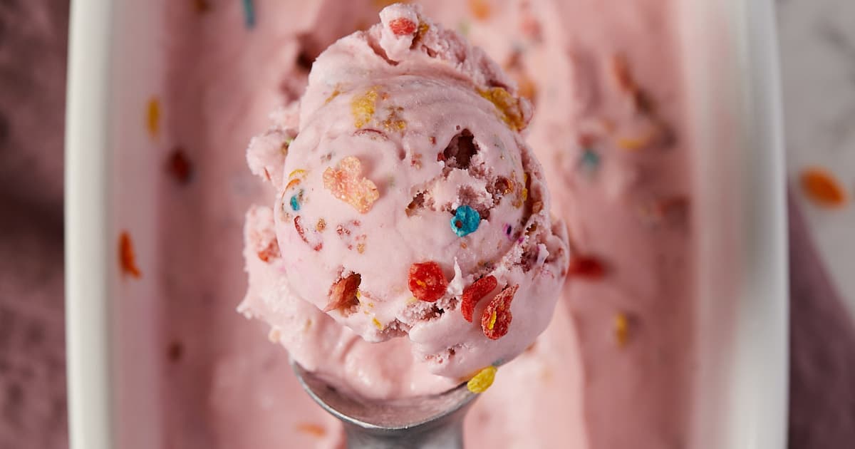 Overhead view of fruity pebble ice cream on a scoop.