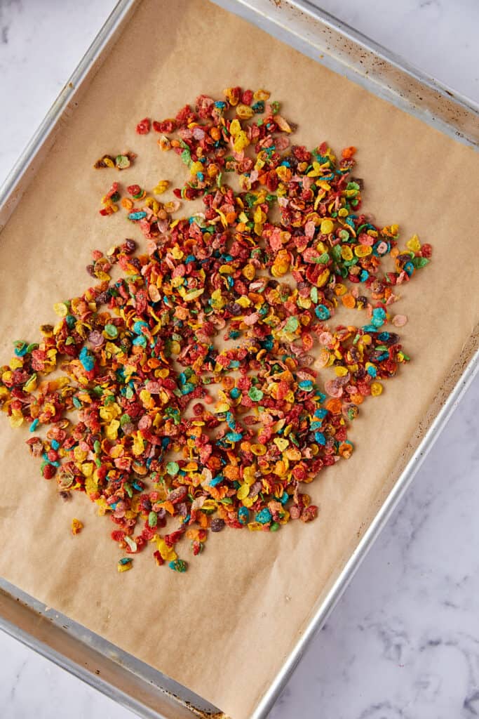 Overhead view of fruity pebbles crunch on a sheet pan. 