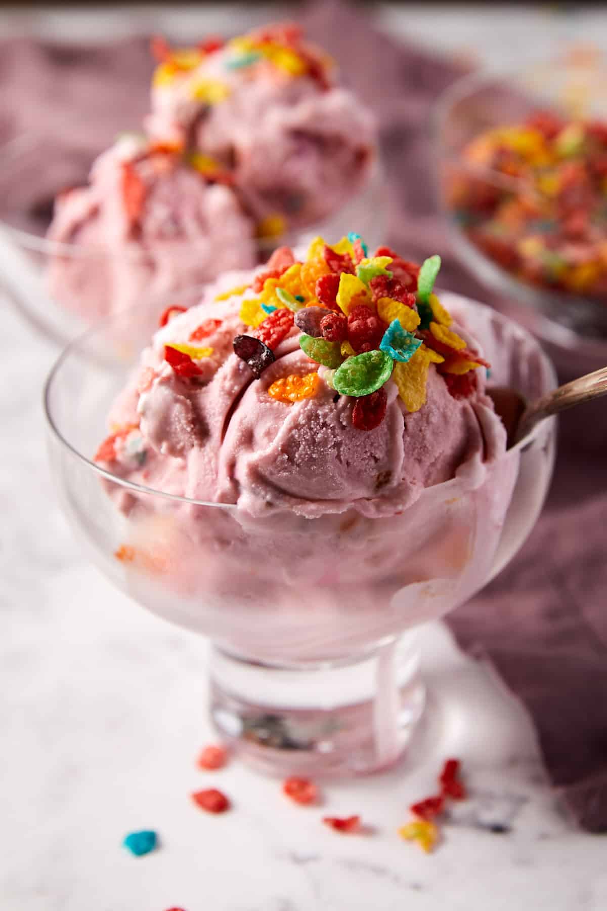 Fruity Pebble in bowl of ice cream with spoon