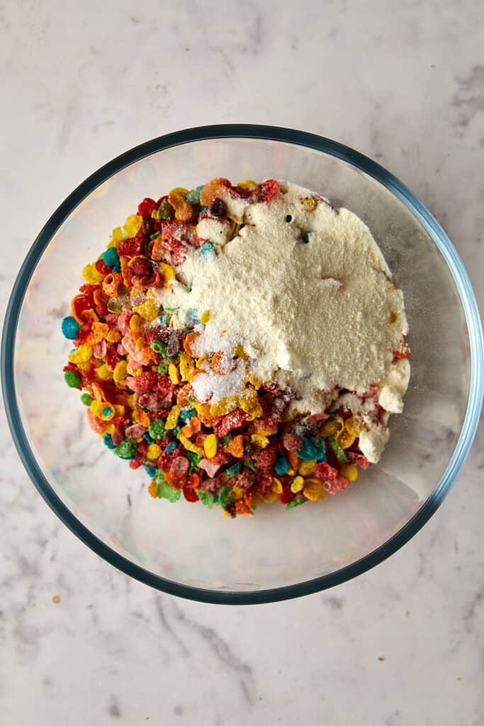 Overhead view fruity pebbles with dry ingredients added.