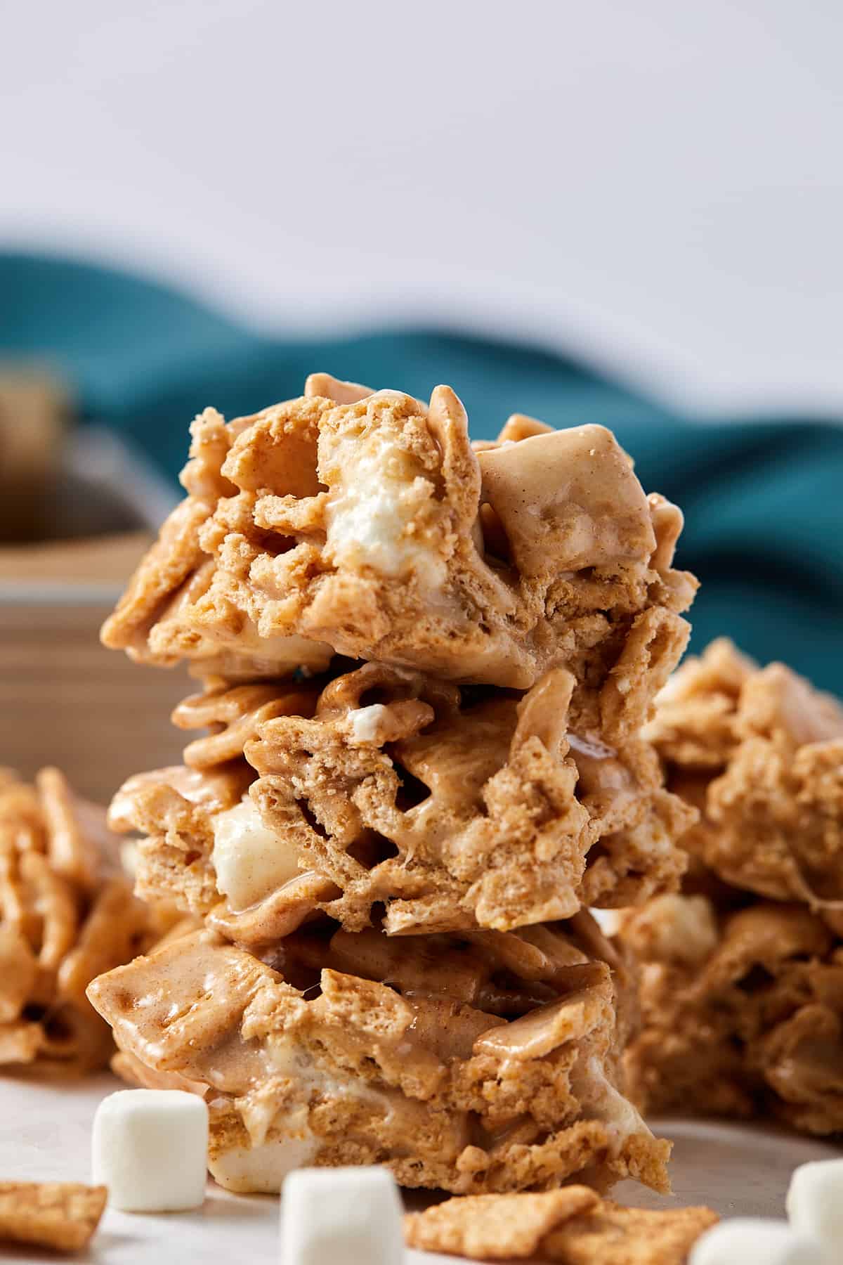 Close up view of cinnamon toast crunch treats stacked on top of each other. 