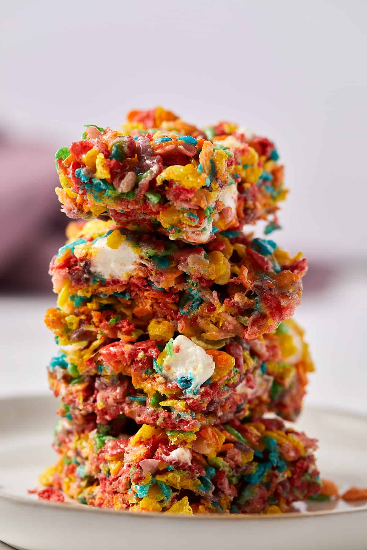 A close up view of a stack of fruity pebbles marshmallow treats.