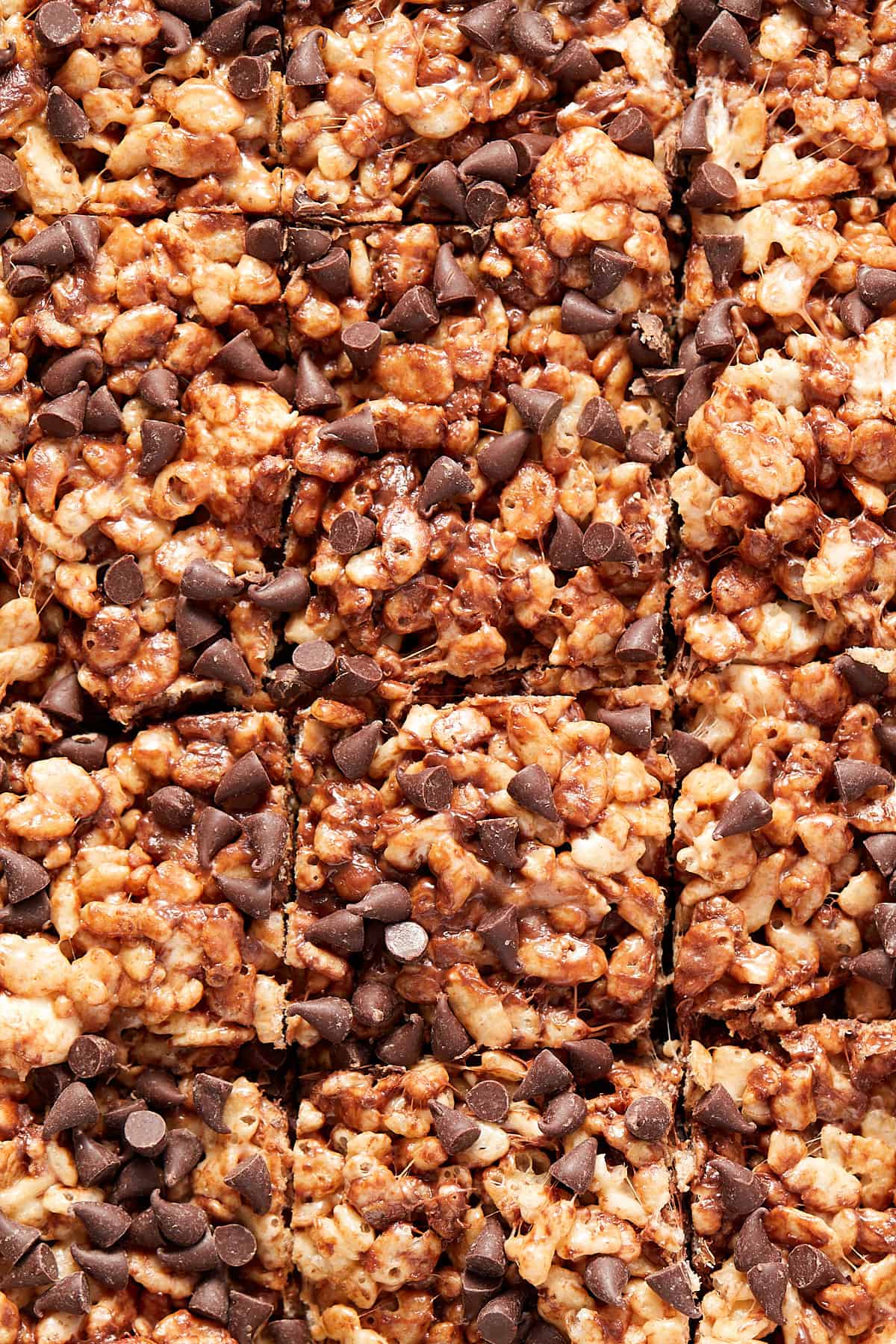 Overhead view of Chocolate chip Rice Krispie treats cut in a square pan.