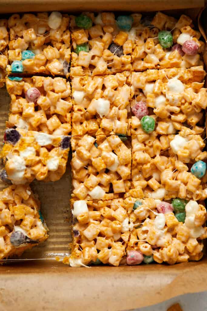 Overhead view of Captain Crunch treat cut into bars in a pan.
