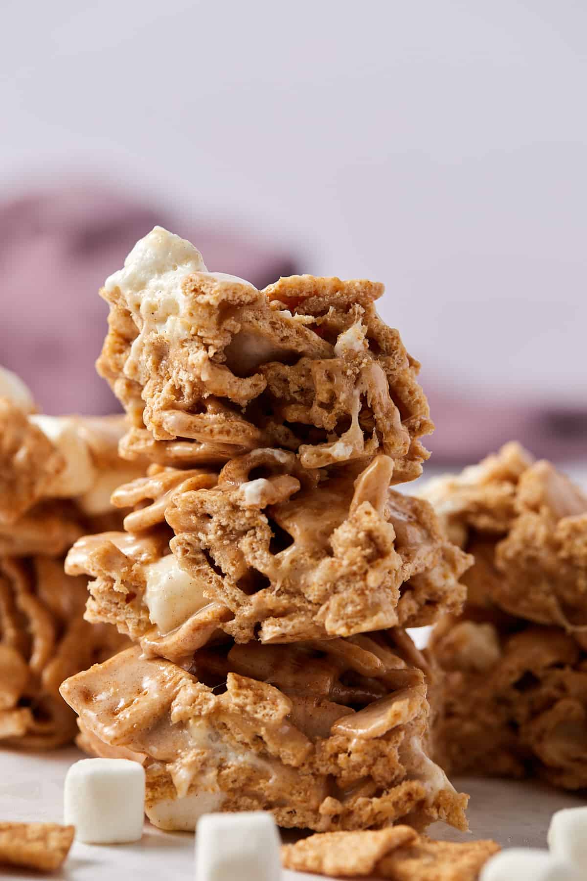 Close up view of a stack of cinnamon toast crunch marshmallow treats. 