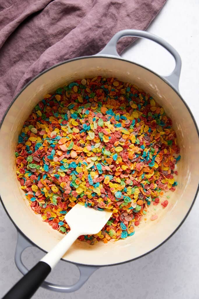 Fruity pebbles poured on top of melted marshmallows.