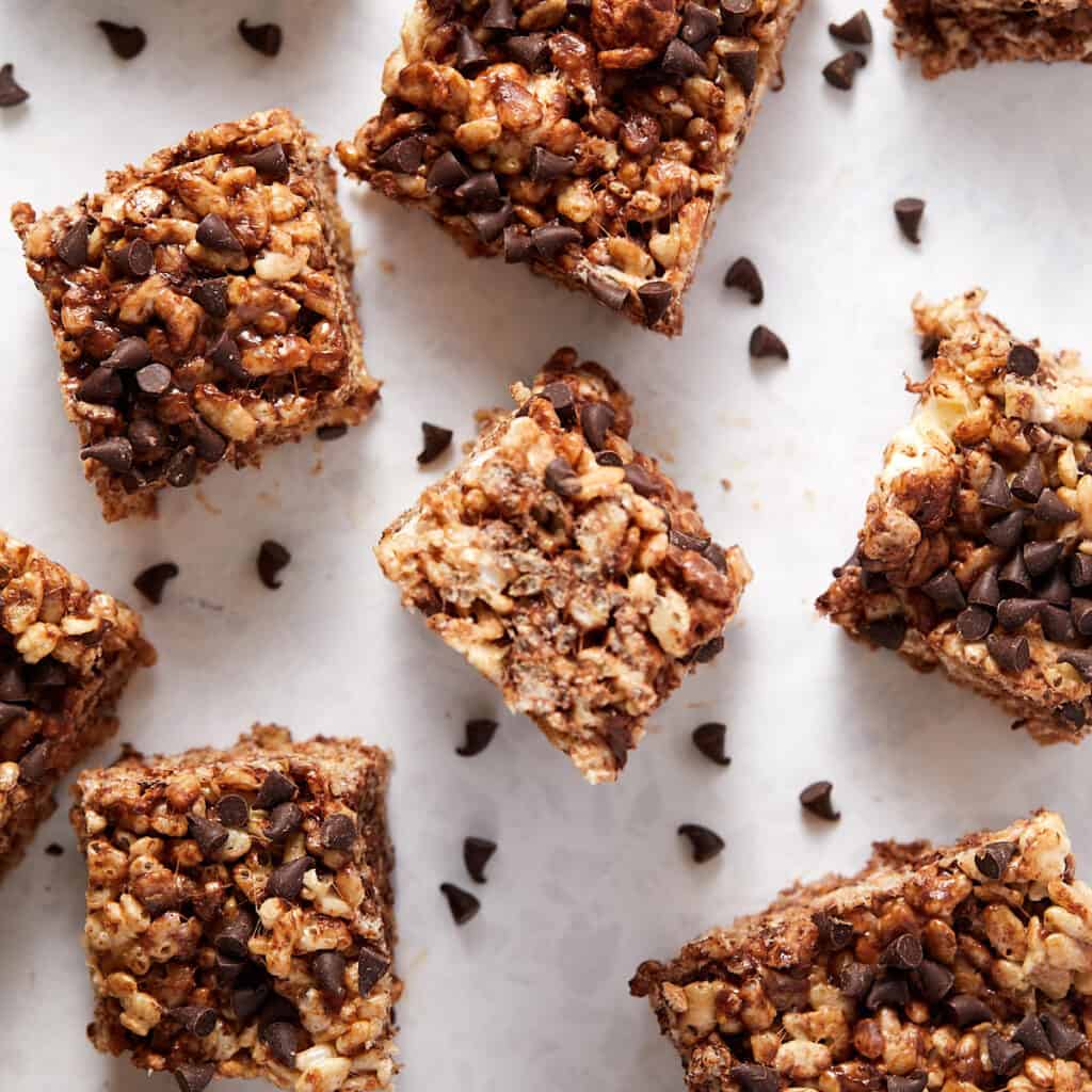 Overhead view of Chocolate Chip Rice Krispie treats cut into square pieces.