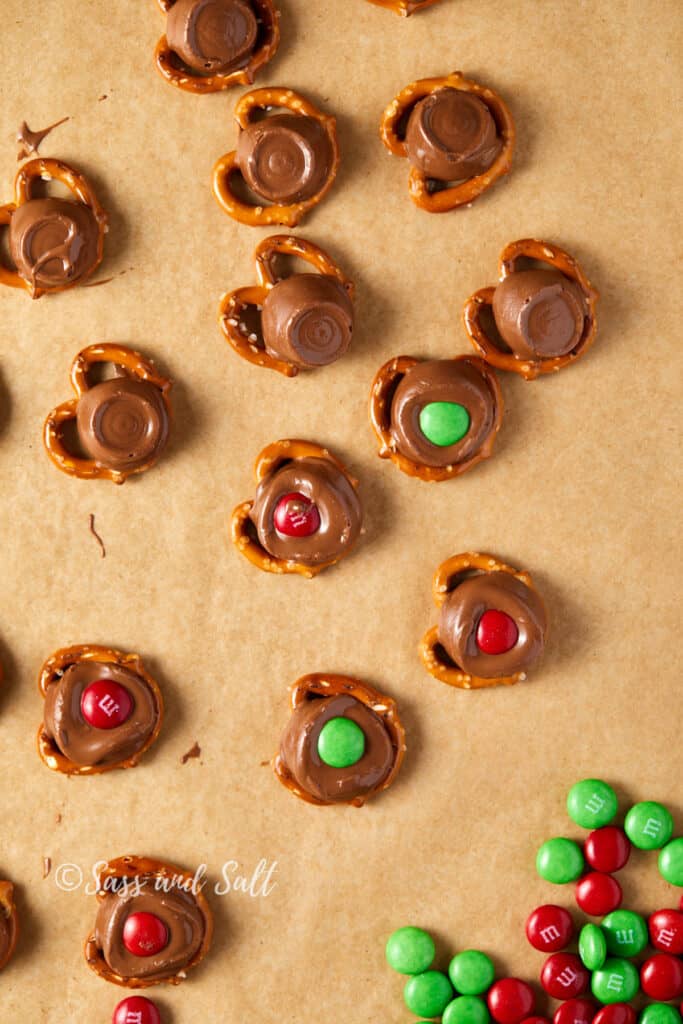 Overhead close-up of Rolos on pretzels with M&M's pressed into the top of the Rolo.