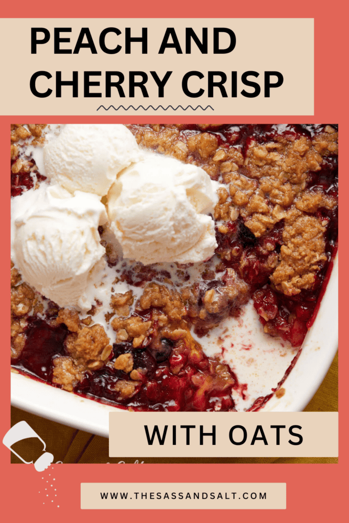 Close-up of a peach and cherry crisp dessert in a white bowl, topped with two scoops of vanilla ice cream, with a red background featuring the text "peach and cherry crisp" and a website url.