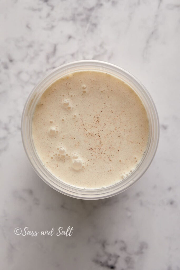 A top-down view of a cinnamon toast crunch milk in a plastic container.