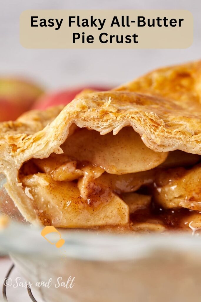A close-up of a slice of apple pie with an easy flaky all-butter pie crust, overlaid with text reading “Easy Flaky All-Butter Pie Crust.”