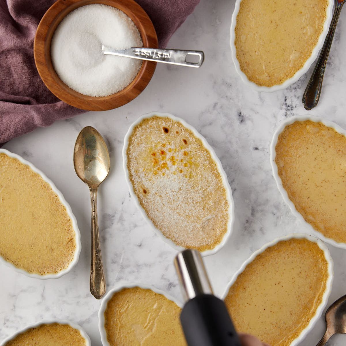 Torching the sugar on top of a pumpkin creme brulee.