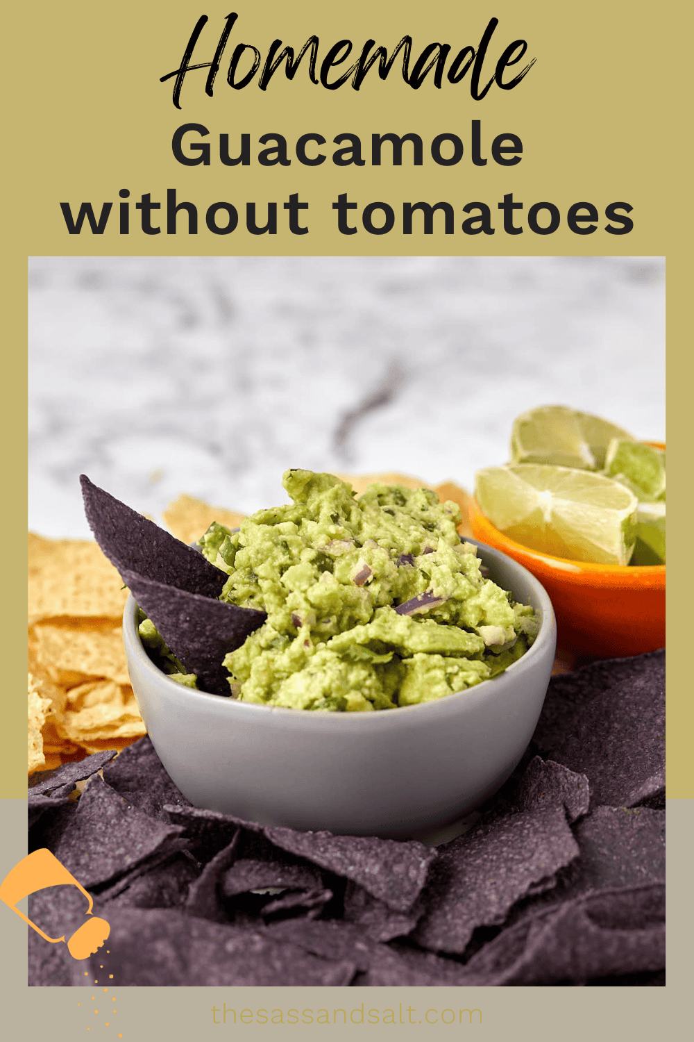 A bowl of homemade guacamole is placed on a table, garnished with fresh lime wedges. It's surrounded by blue corn chips and tortilla chips. The text at the top reads, "Homemade Guacamole without tomatoes.