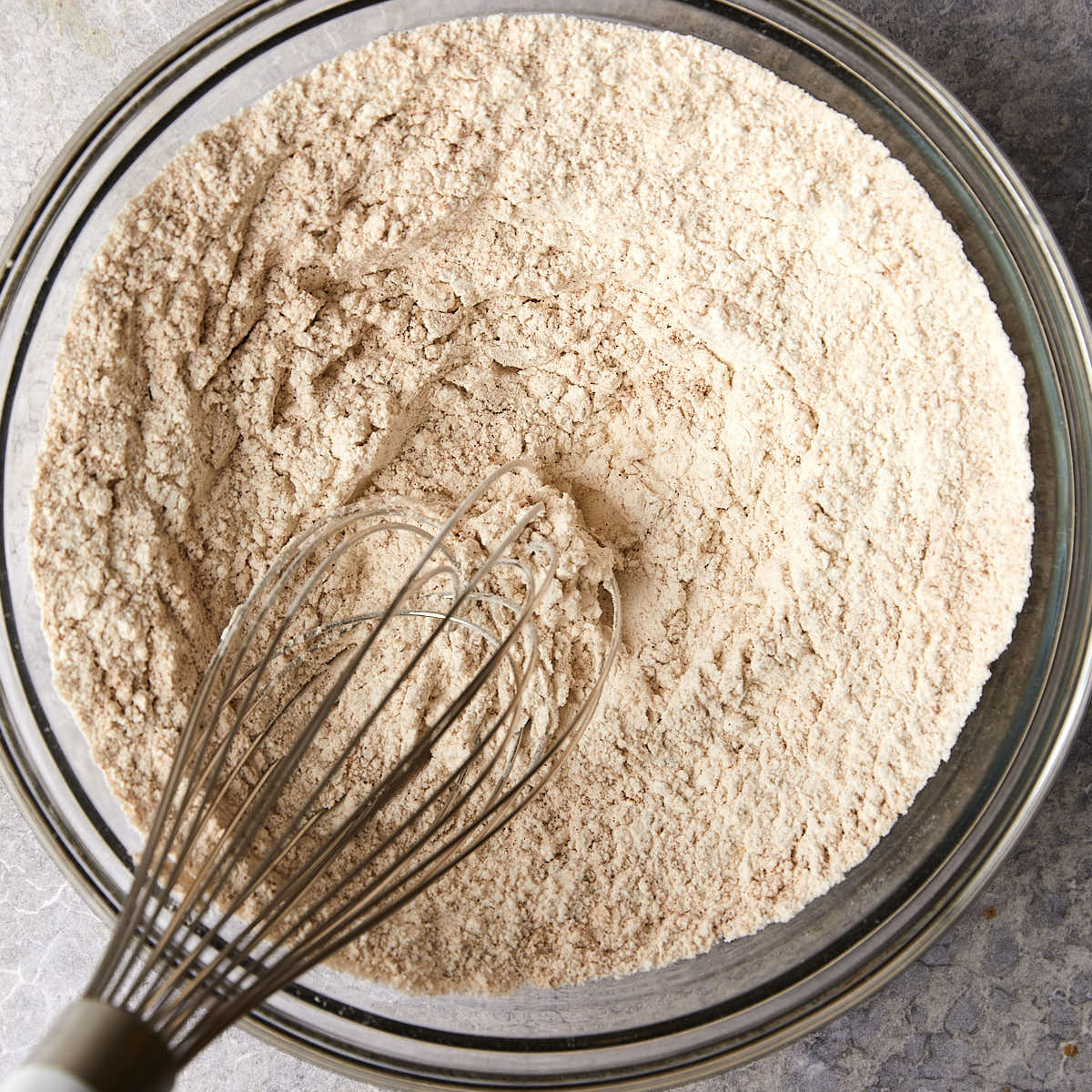 Dry ingredients whisked for apple cider muffins.