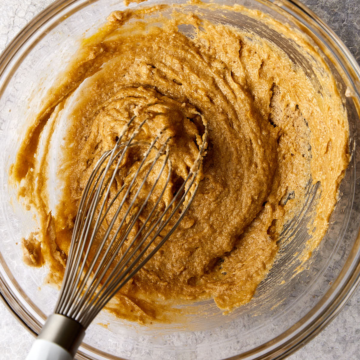 Cider reduction and sour cream whisked into muffin batter.