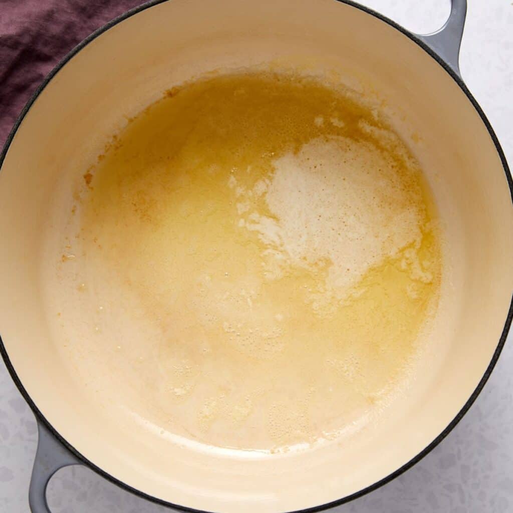 Unsalted butter melting in a pot for a Captain Crunch treats recipe.
