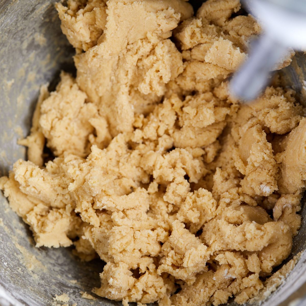 Flour mixed into the thick fruity pebbles cookie dough.