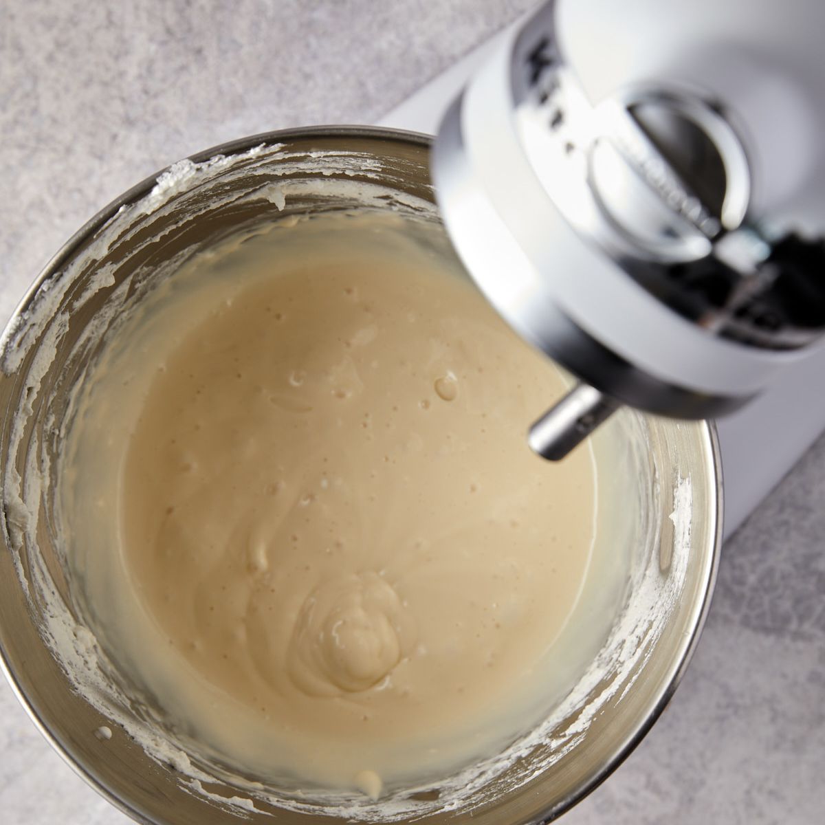 Cream cheese, condensed milk, and pudding whipped smooth for banana pudding cups.