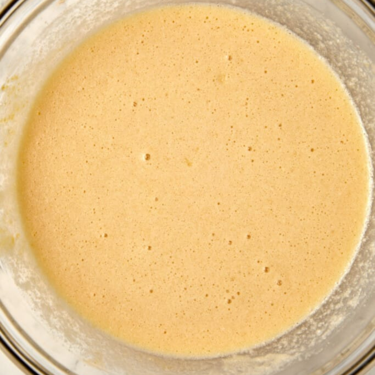 Wet ingredients mixed for apple cider donut loaf.