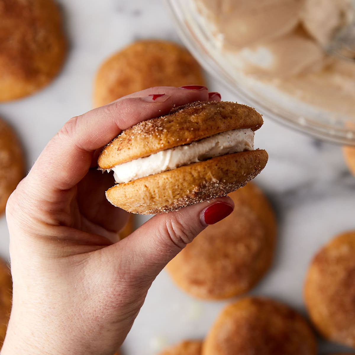 Assembled apple cider whoopie pie in hand.